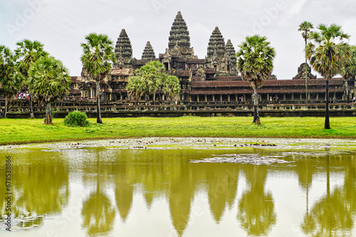 Angkor Wat Temple Complex reflected in the lake at Sunrise - UNESCO World Heritage 12th century masterpiece of Khmer Architecture built by Suryavarman II at Siem Reap  Cambodia  Asia