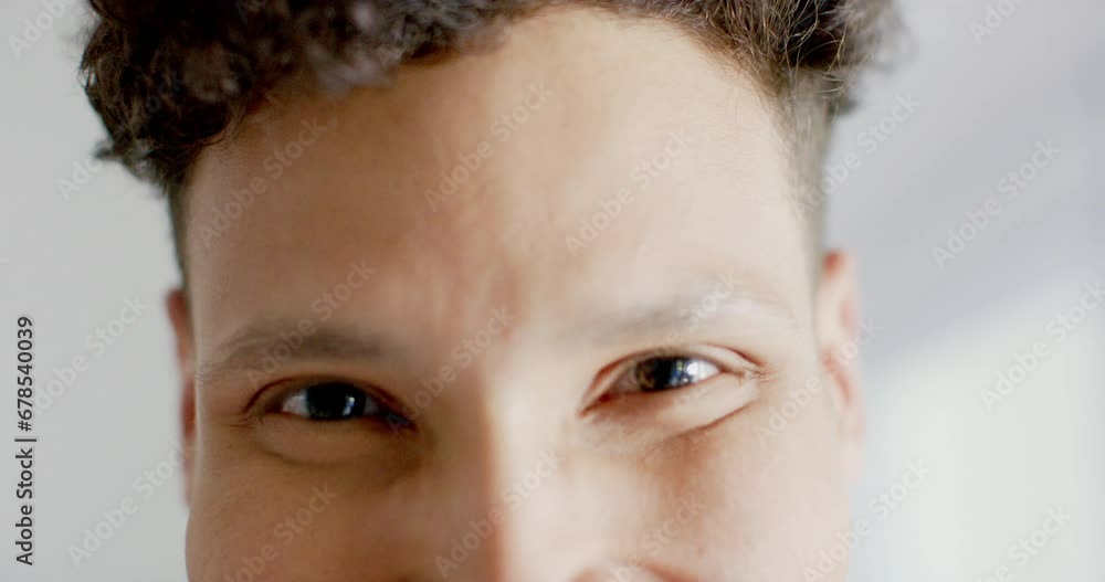 Portrait of happy biracial man looking at camera at home, in slow motion Portrait of happy biracial man looking at camera at home, in slow motion