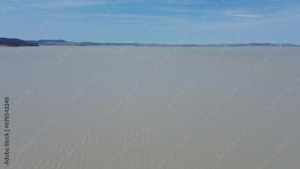 Drone aerial shot of Lake George freshwater river catchment with sky mountain hill background Goulburn Sydney NSW ACT nature tourism travel Australia 4K Drone aerial shot of Lake George freshwater river catchment with sky mountain hill background Goulburn Sydney NSW ACT nature tourism travel Australia 4K