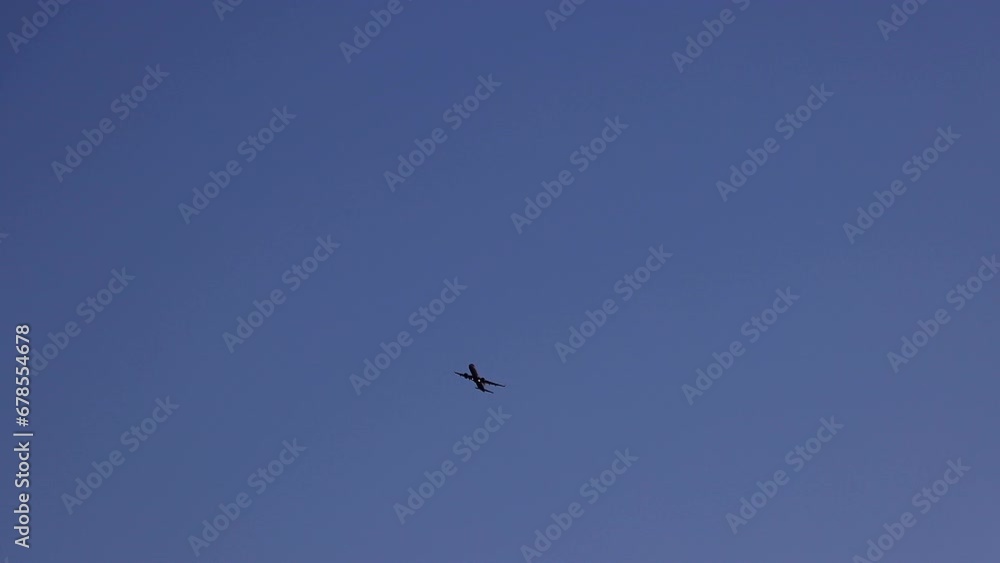 Silhouette of a plane rising into the sky at dawn, a departing plane against the background of the sky before sunrise. Silhouette of a plane rising into the sky at dawn, a departing plane against the background of the sky before sunrise.