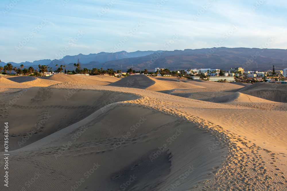Sand dunes of Maspalomas with a view of the city on Gran Canaria, Spain