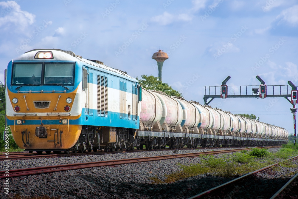 Obraz premium Locomotive with Tanker-freight train on the railway.