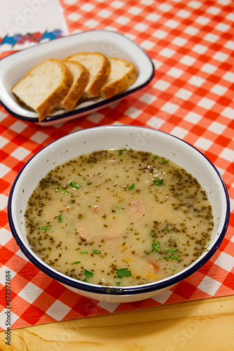 Traditional Polish soup Zurek on a table