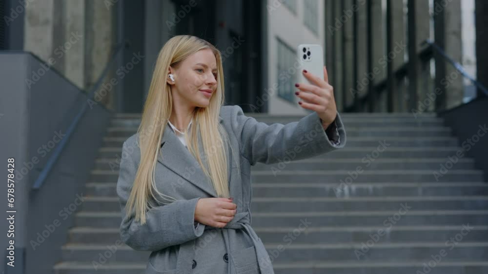 Joyful Manager Capturing Selfie with Her Smartphone and Posting to Social Media. Corporate Woman Taking a Picture During Her Lunch Break at a Modern Office Center. People and Technology Concept Joyful Manager Capturing Selfie with Her Smartphone and Posting to Social Media. Corporate Woman Taking a Picture During Her Lunch Break at a Modern Office Center. People and Technology Concept