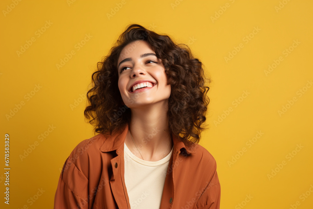 Radiant Glow: Happy Young Woman Gazing Away with a Joyful Smile, Standing Confidently in a Studio Background, Capturing a Moment of Contentment Radiant Glow: Happy Young Woman Gazing Away with a Joyful Smile, Standing Confidently in a Studio Background, Capturing a Moment of Contentment