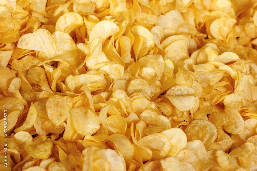 Food Texture of Fresh Crispy potato chips snack background, top view Food Texture of Fresh Crispy potato chips snack background, top view