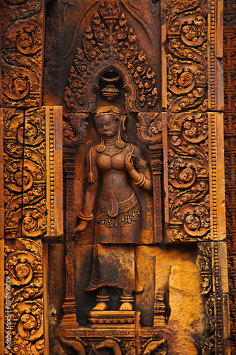 Devata carving, Banteay Srei temple, Angkor, Cambodia. The citadel of women, this temple contains the finest, most intricate carvings to be found in Angkor. 967 CE