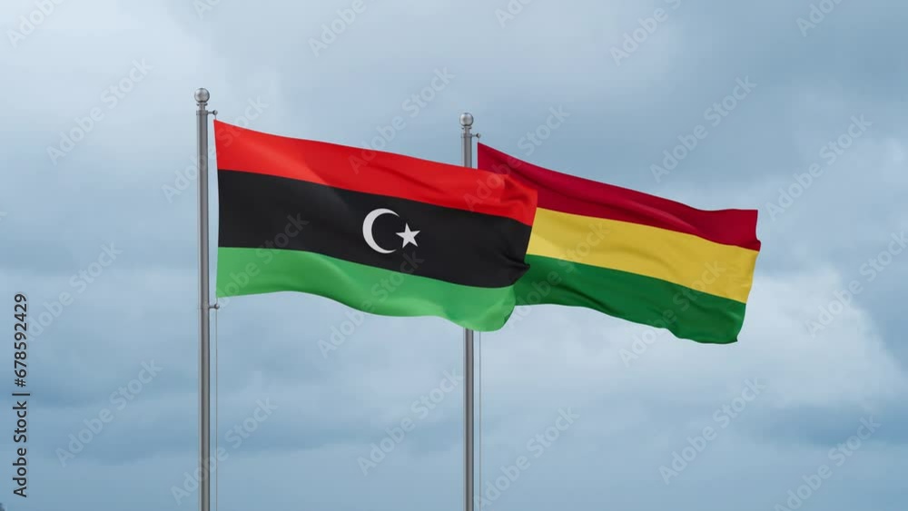 Bolivia flag and Libya flag waving together on cloudy sky, endless seamless loop, two country relations concept Bolivia flag and Libya flag waving together on cloudy sky, endless seamless loop, two country relations concept