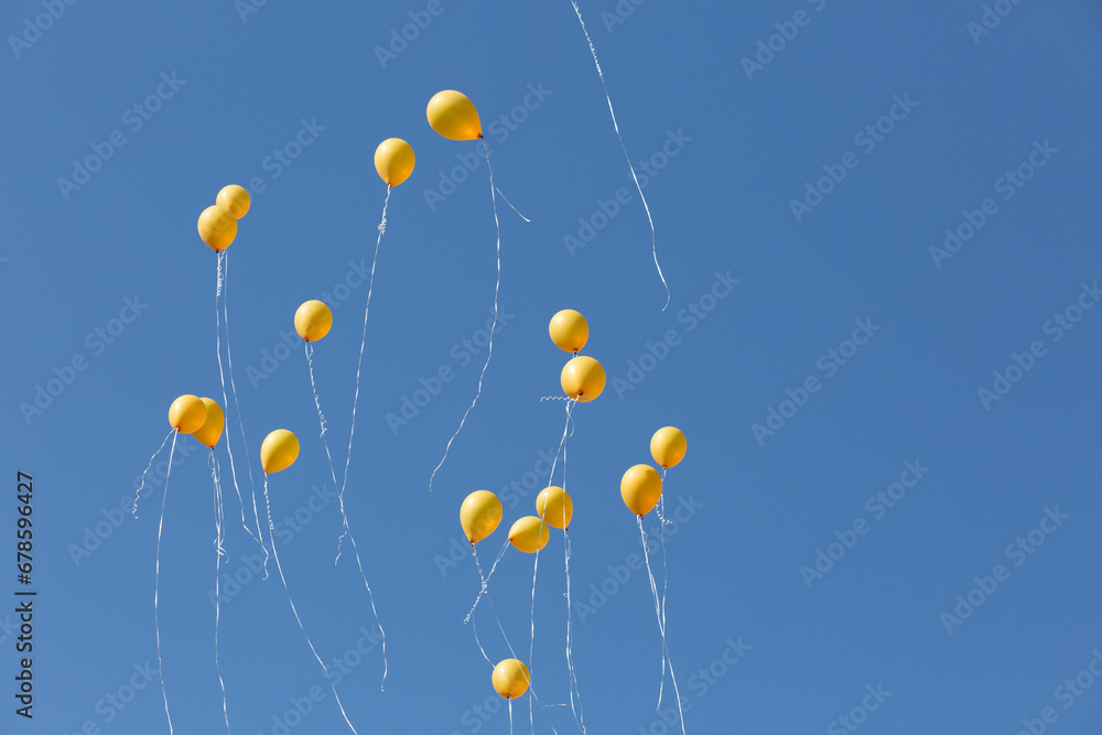 yellow air balloons against the blue sky yellow air balloons against the blue sky