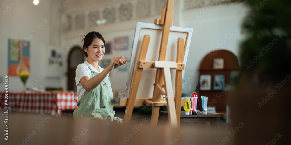Obraz premium Talented Female Artist Working on a artist lifestyle. painting hobby. woman drawing beautiful draw watercolor design