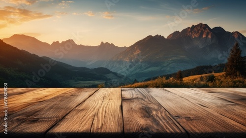 Wooden table with a background of a mountain landscape during sunrise 