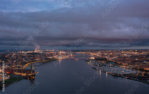 Fotografie Aerial panoramic night  skyline cityscape of Aalborg, North Jutland Region (Nordjylland), Denmark