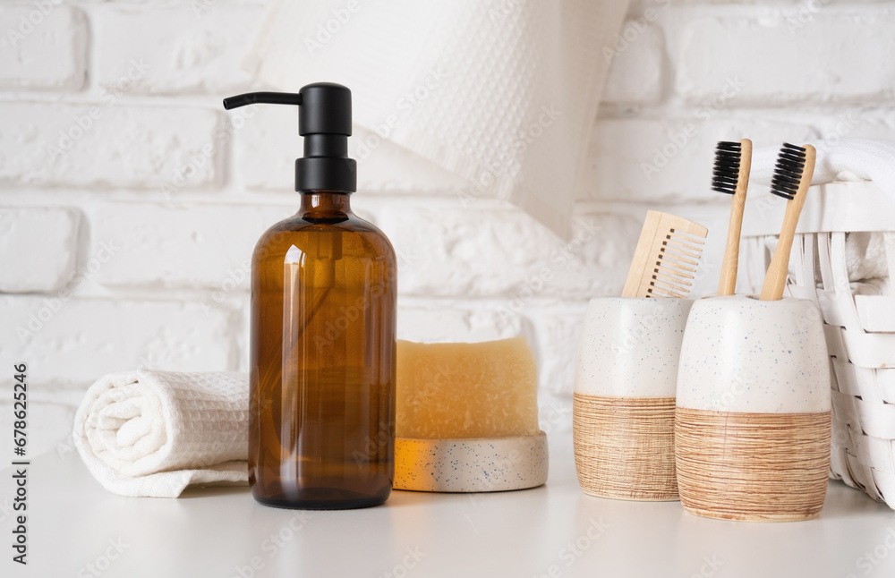 Recycled plastic pump bottle for mockup on white brick wall background Recycled plastic pump bottle for mockup on white brick wall background