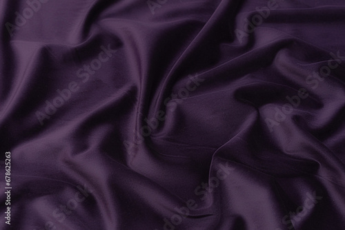 Abstract background texture of natural violet, purple or lilac color fabric. Fabric texture of natural cotton or linen, silk or satin, wool or jersey textile material. Luxurious modern canvas textile