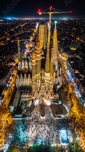 Aerial view of La Sagrada Família in the night. Spanish basilica in Barcelona. Drone footage of the cathedral designed by Antoni Gaudí.