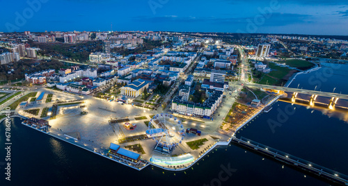 Night aerial view of Cheboksary cityscape on banks of Volga River, Chuvashia, Russia