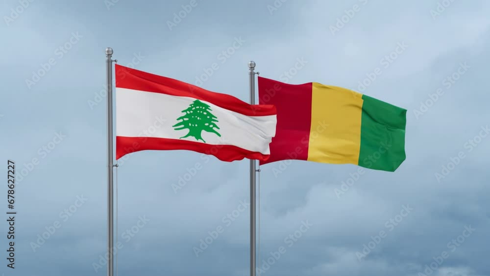 Republic of Guinea flag and Lebanon flag waving together on cloudy sky, endless seamless loop, two country relations concept Republic of Guinea flag and Lebanon flag waving together on cloudy sky, endless seamless loop, two country relations concept