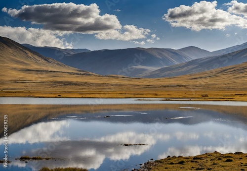Conjure the natural grandeur of  Pakistan's Sheosar Lake in the Deosai National Park, highlighting its pristine beauty amid the vast plains and rolling hills.