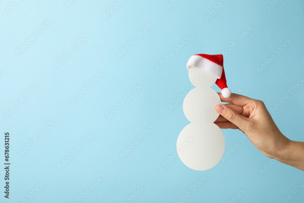 Decorative snowman made of paper balls and Santa's hat Decorative snowman made of paper balls and Santa's hat