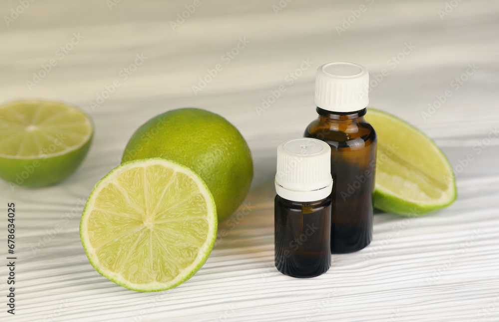 Oil essence bottle with citrus extracts. Selective focus. Spa day, concept of freshness oil bottle with lime extract Oil essence bottle with citrus extracts. Selective focus. Spa day, concept of freshness oil bottle with lime extract