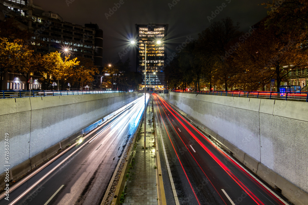 Fototapeta premium The Hague, Netherlands Traffic streaks on a sunken highway, Utrechtsebaan, at night.