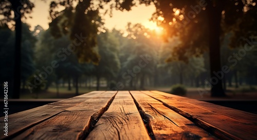 Wooden Table Perspective Leading to a Serene Sunrise in a Peaceful Park Landscape