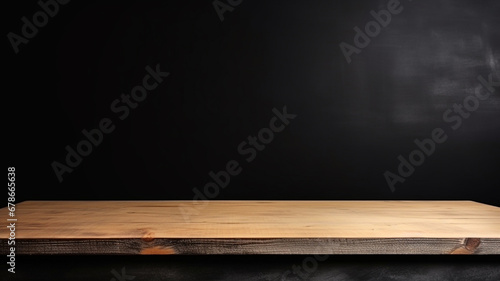 Empty wooden table top on black dark concrete wall