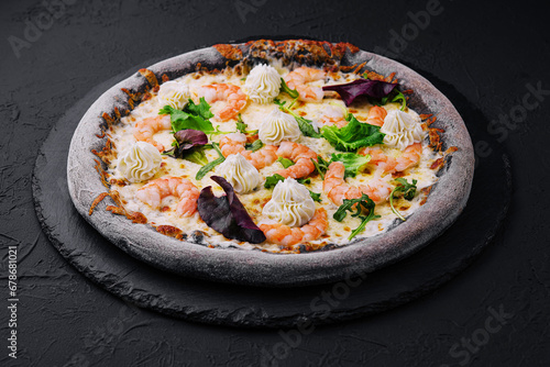 black pizza with shrimp and cream