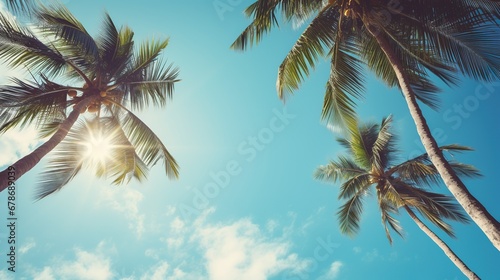 Blue sky and palm trees view from below, vintage style, tropical beach and summer background © LaxmiOwl