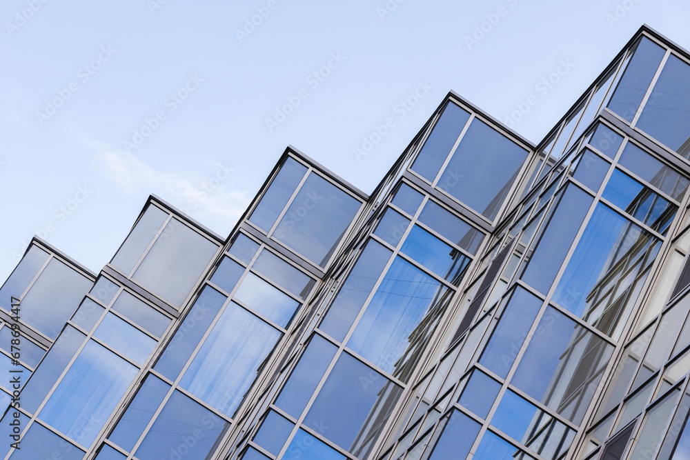 Office facade corners made of steel framework and shiny glass Office facade corners made of steel framework and shiny glass