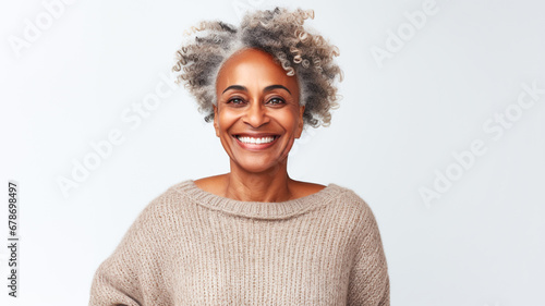 Beautiful mature african-american woman on a solid color background.