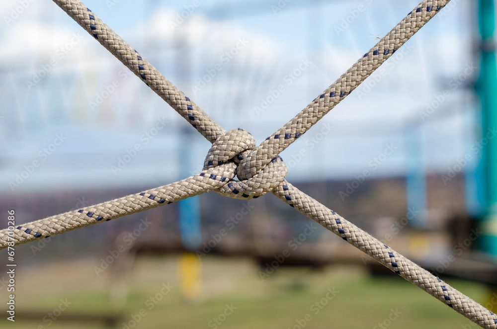many ropes and one big knot close up many ropes and one big knot close up