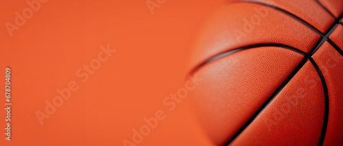 Close-up shot of orange basketball The background is orange. photo