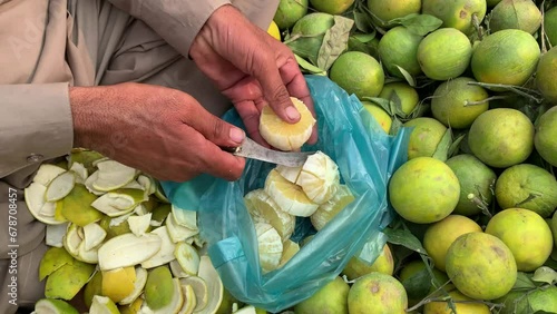 Mosami Orange. Musambi Orange royalty. Orange Slices. Kerala Fruit. Citrus limetta. Musambi s Colour is Green. A man has been musami orange Slices. photo