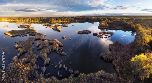 Aerial panoramic sunset sunrise scene at swamps and wetlands, Lake bog landscape. © TTstudio