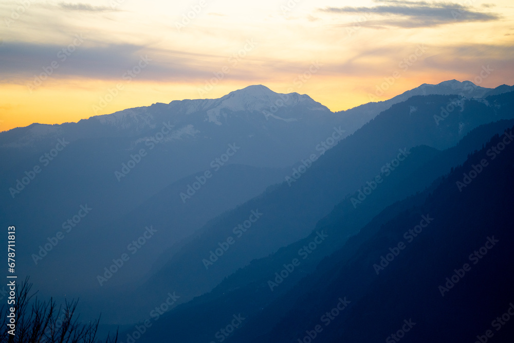 Orange blue hues of Himalaya mountains from shimla showing the serenity of this popular tourist destination at sunset