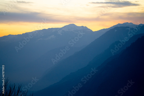 Orange blue hues of Himalaya mountains from shimla showing the serenity of this popular tourist destination at sunset