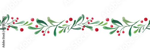 Watercolor seamless Christmas seamless border. Illustration with green branches and red berries. Horizontal border for the design of Christmas and New Year packaging. Postcard, congratulations. photo