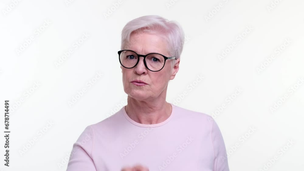 Stern faced woman shakes finger in a gesture of admonishment, expression reflecting authority and seriousness. Her resolute demeanor captures a moment of clear warning. Stern faced woman shakes finger in a gesture of admonishment, expression reflecting authority and seriousness. Her resolute demeanor captures a moment of clear warning.
