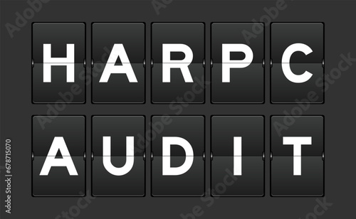 Black color analog flip board with word HARPC (Hazard analysis and risk-based preventive controls) audit on gray background