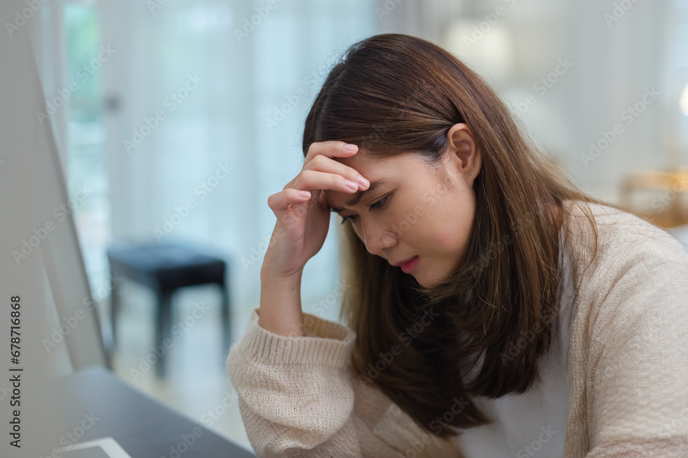 Women are tired and stressed from working hard with laptop. Female depression and anxiety. Headache overwhelmed migraine with hard work. Women are tired and stressed from working hard with laptop. Female depression and anxiety. Headache overwhelmed migraine with hard work.
