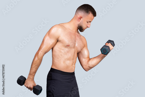 Focused sweat muscular young european guy athlete with naked torso  enjoy strength power workout