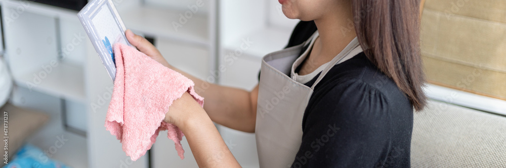 © Puwasit Inyavileart - Housewives use towels to wipe things, tables, chairs, display cabinets and glass inside the house, Big cleaning, Housework, Daily routine, Clean up on weekends. © Puwasit Inyavileart - Housewives use towels to wipe things, tables, chairs, display cabinets and glass inside the house, Big cleaning, Housework, Daily routine, Clean up on weekends.