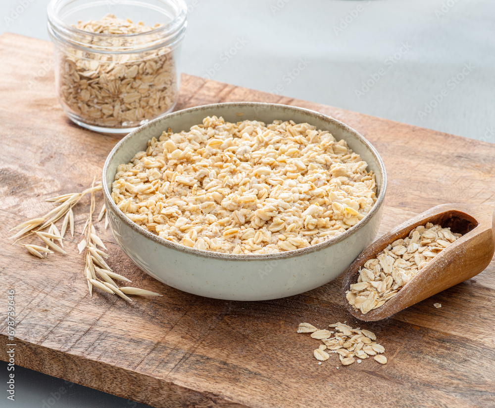 Bowl of porridge or oatmeal on wooden table. Top view. Bowl of porridge or oatmeal on wooden table. Top view.