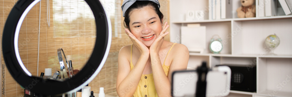 Beautiful woman with a social media influence is greeting the audience for recording vlog video live streaming, Showing how to make up and use cosmetics, Online business on concept of beauty bloggers. Beautiful woman with a social media influence is greeting the audience for recording vlog video live streaming, Showing how to make up and use cosmetics, Online business on concept of beauty bloggers.