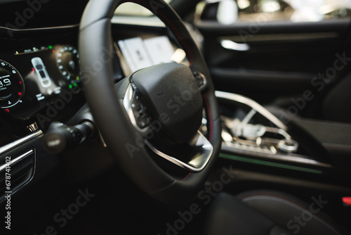 interior of an expensive car, steering wheel, panels © Hanna
