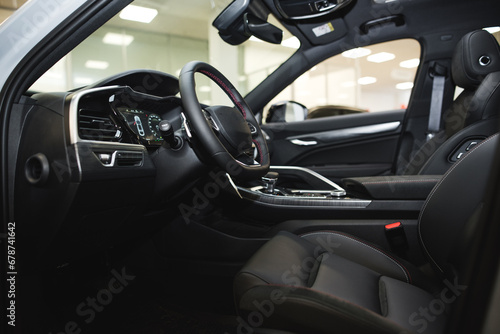 interior of an expensive car, steering wheel, panels © Hanna