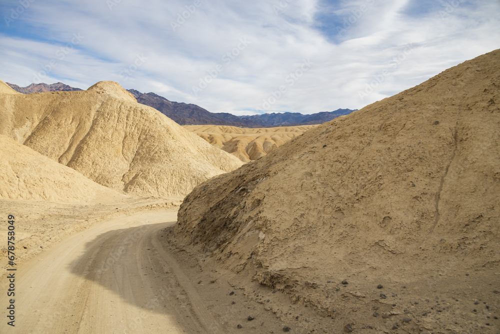 Gravel road through 20 Mule Team Canyon at Death Valley National Park, California Gravel road through 20 Mule Team Canyon at Death Valley National Park, California