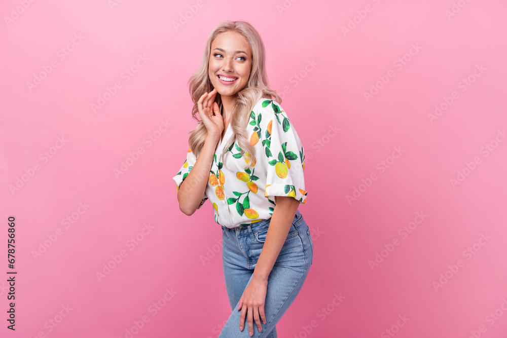 Portrait of nice girlish woman with curly hairdo wear stylish shirt look empty space touching neck isolated on pink color background Portrait of nice girlish woman with curly hairdo wear stylish shirt look empty space touching neck isolated on pink color background
