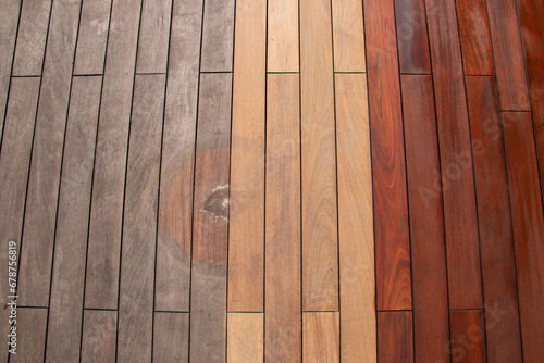 Wood planks texture - weathered with water stain of plant pot, sanded, and freshly oiled ipe deck photo